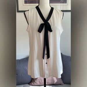 NWT Anne Klein Blouse. White.
Black tie neck, Button front closure. Size Small.